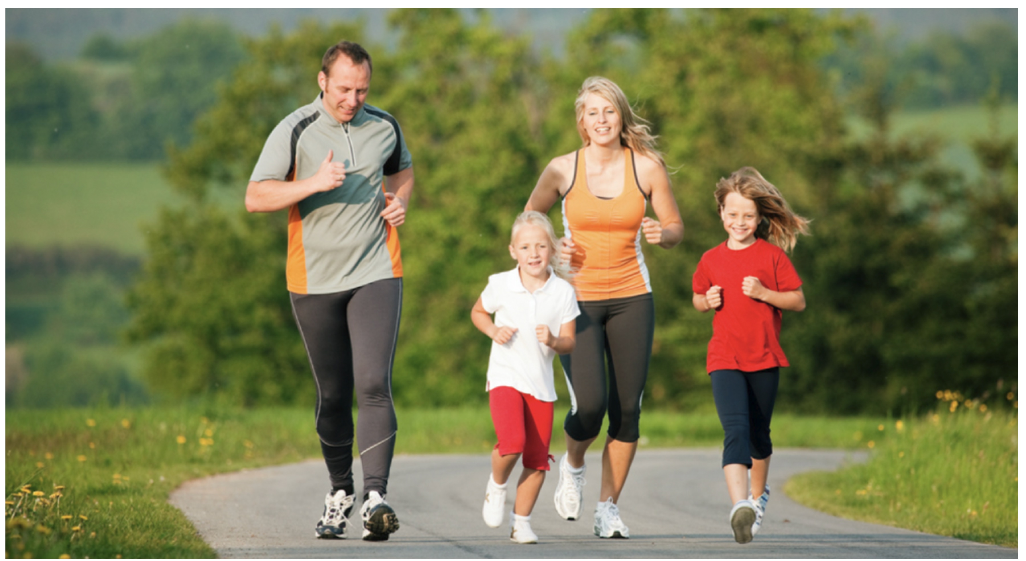 Family running together on a path in nature